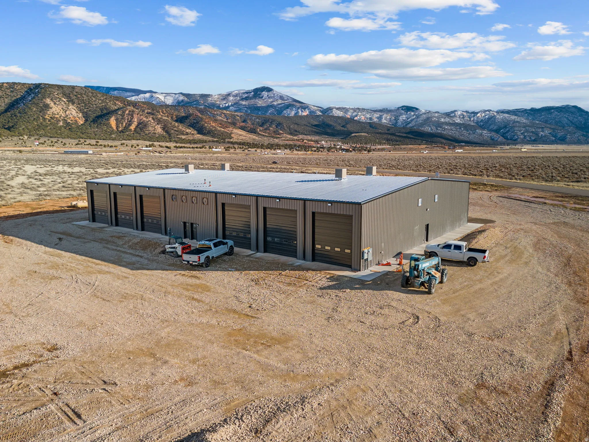 View of outbuilding featuring a mountain view, view of desert, and a rural view