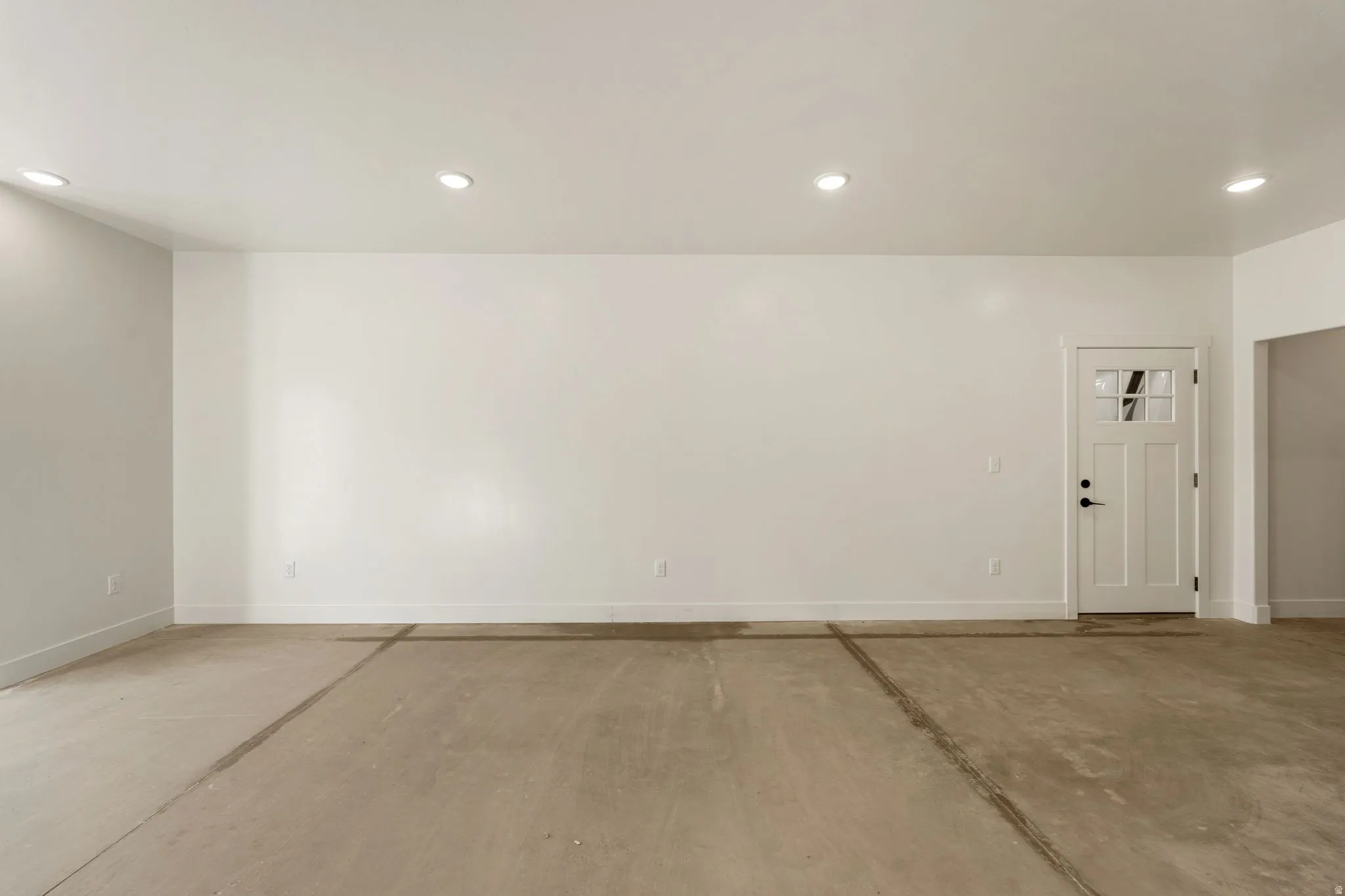 Empty room featuring recessed lighting