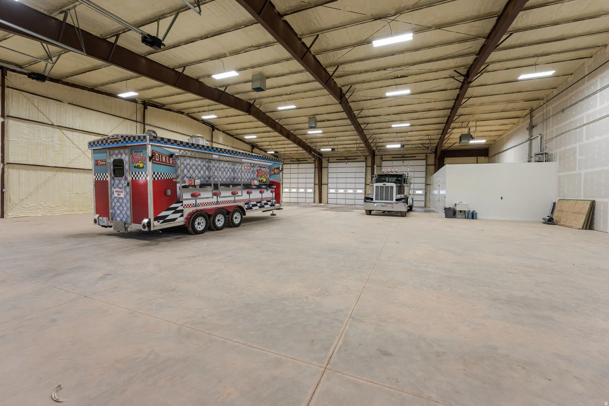 Garage featuring metal wall