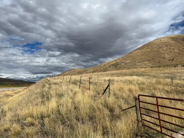 View of mountain background featuring rural landscape