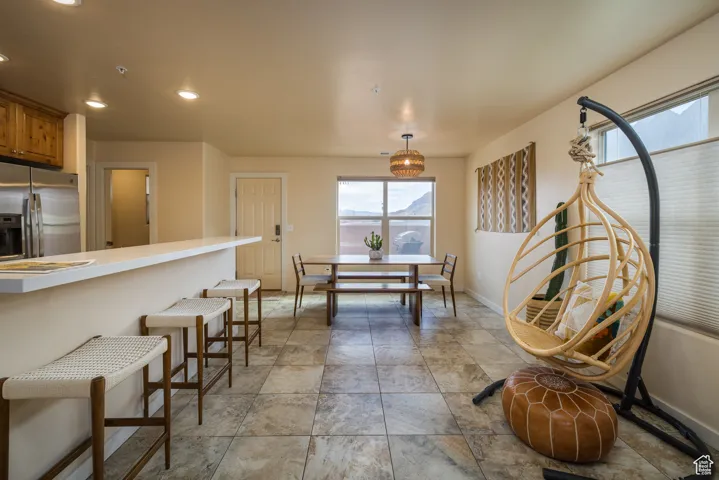 Dining room with baseboards and recessed lighting
