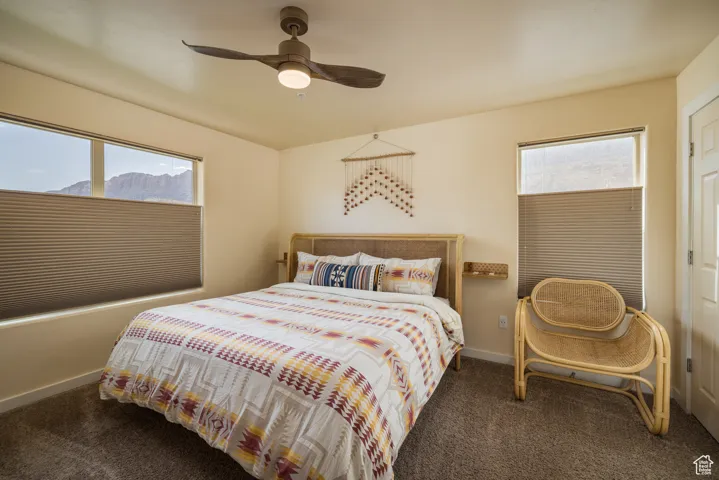 Bedroom featuring carpet flooring and a ceiling fan