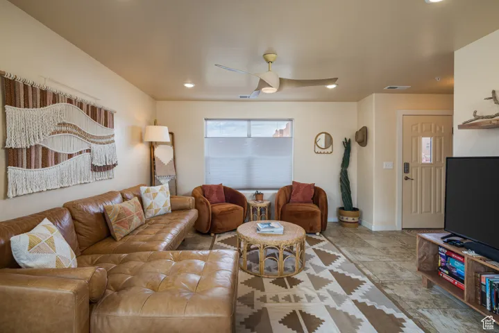 Living room featuring ceiling fan and recessed lighting