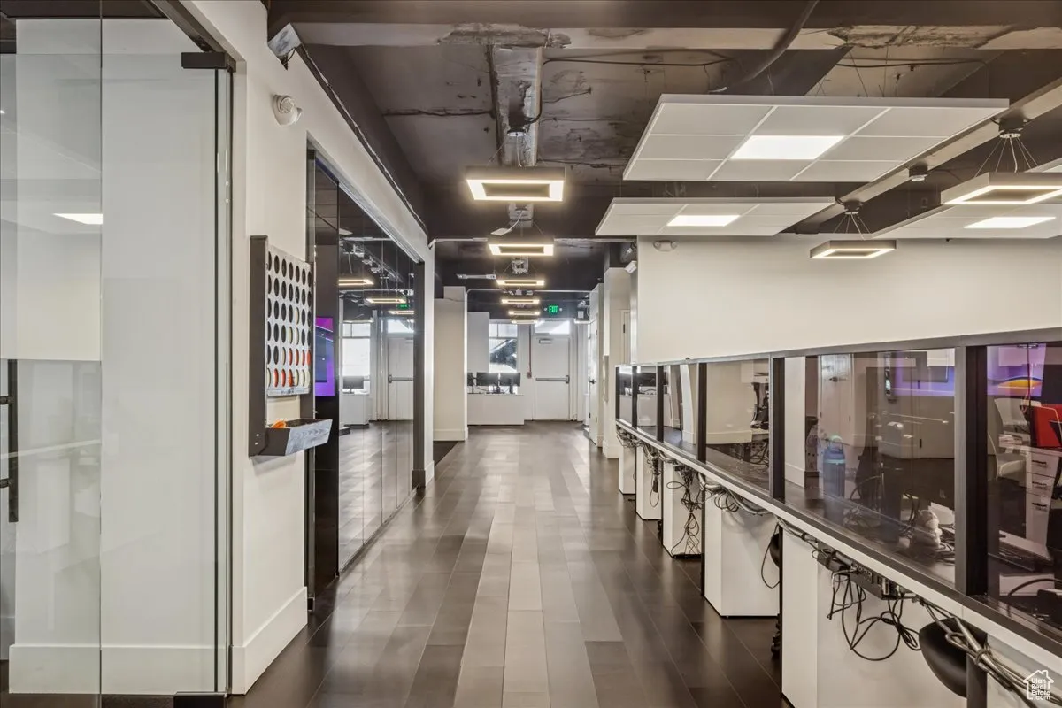 Hallway through production area to additional conference rooms, offices, and executive suite