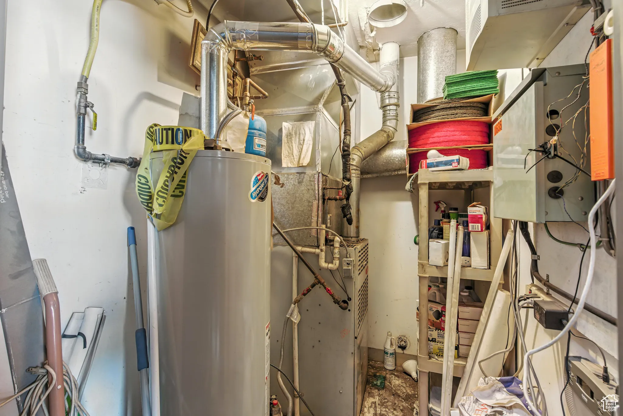 Utilities featuring gas water heater and heating unit