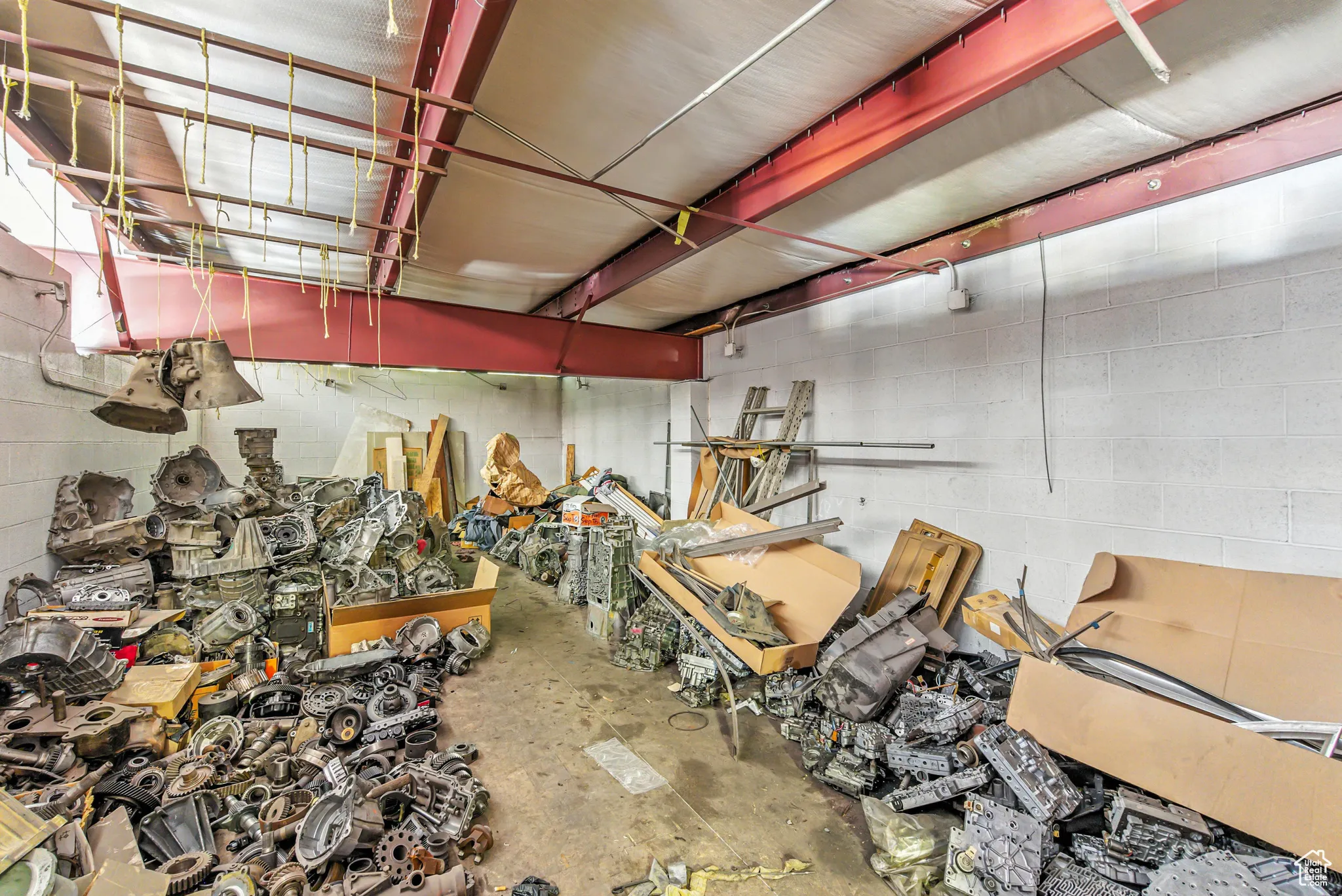Garage featuring concrete block wall