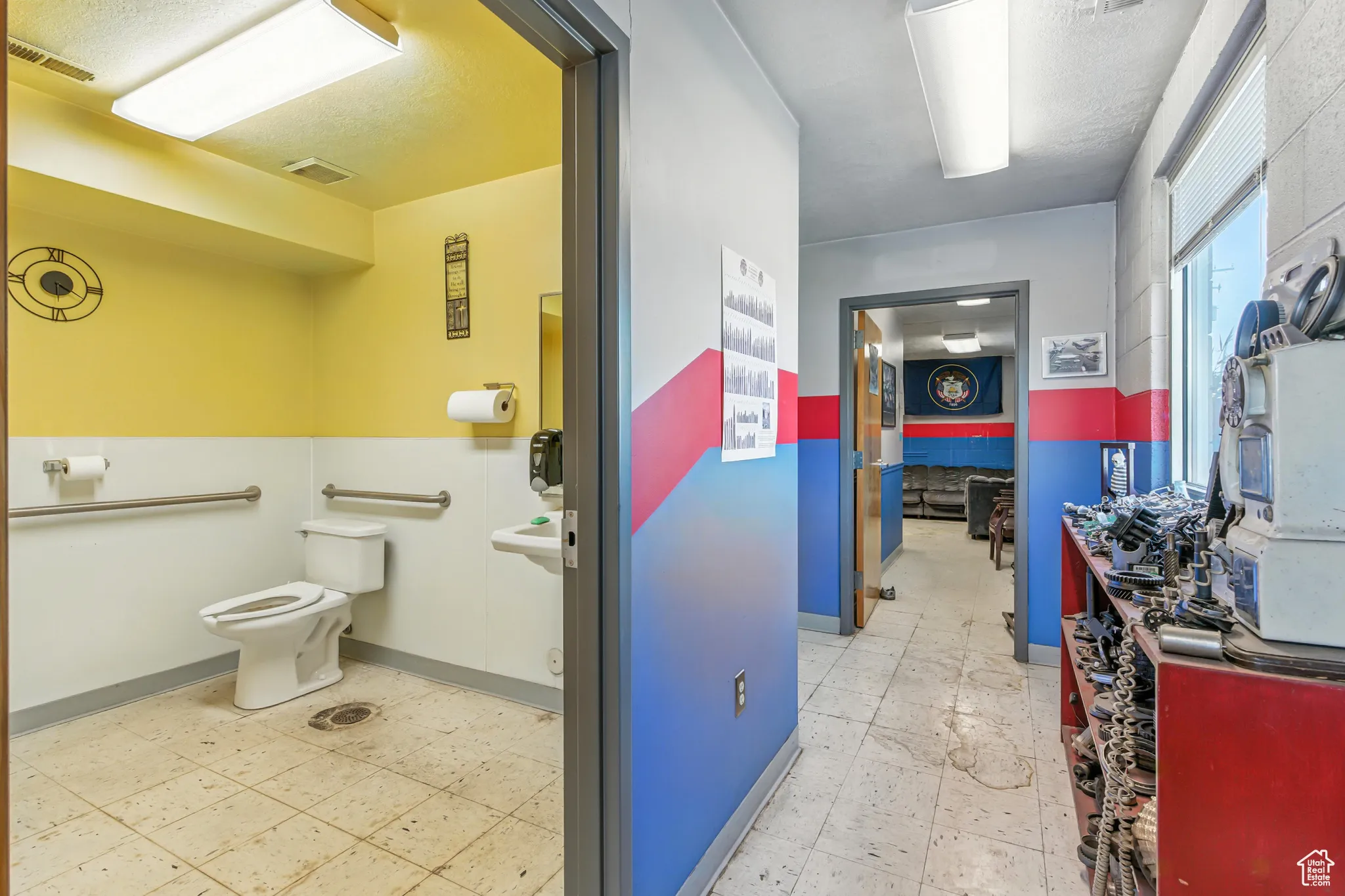 Bathroom with baseboards and light flooring