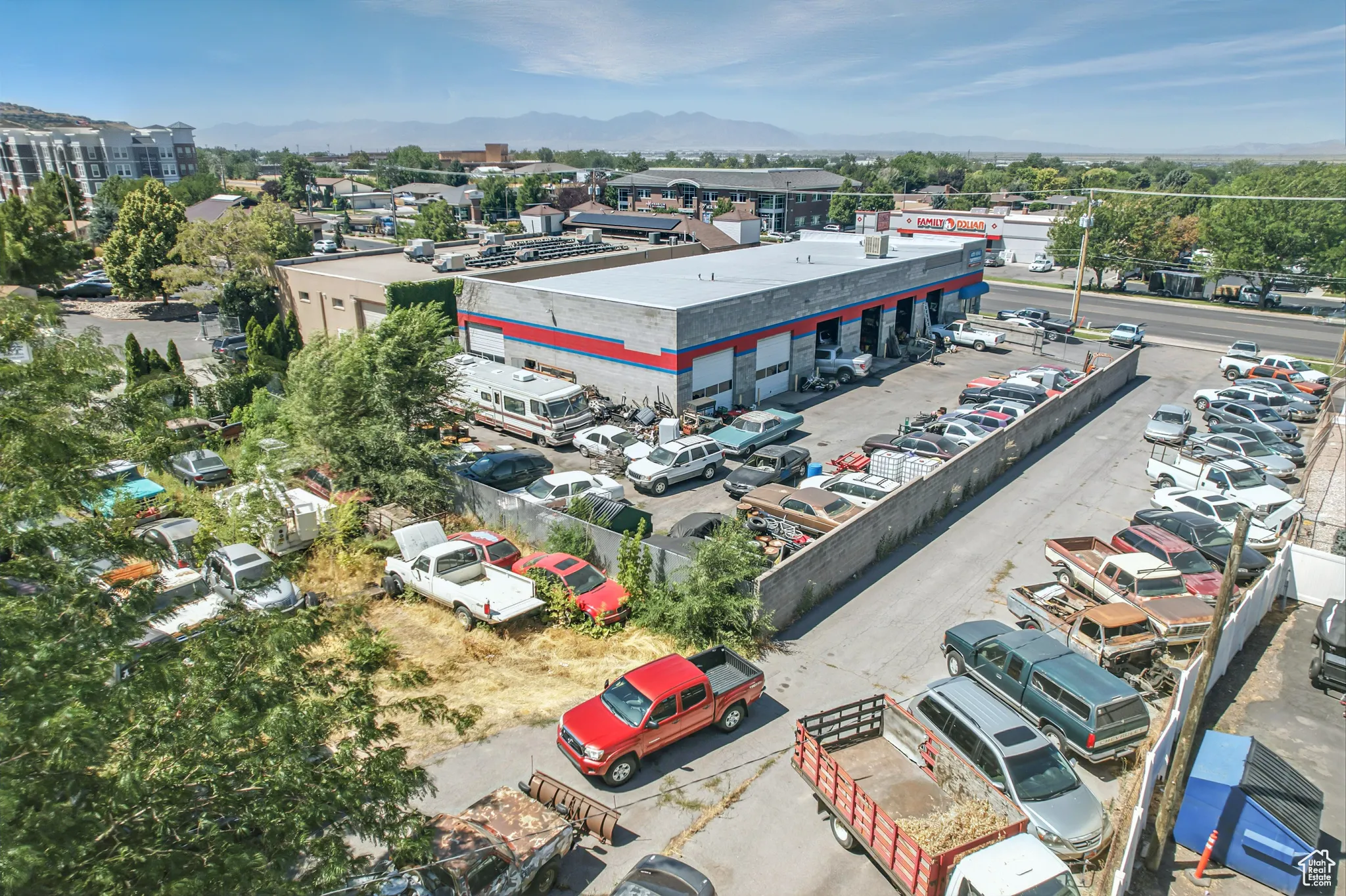 Drone / aerial view of mountains and a commercial area