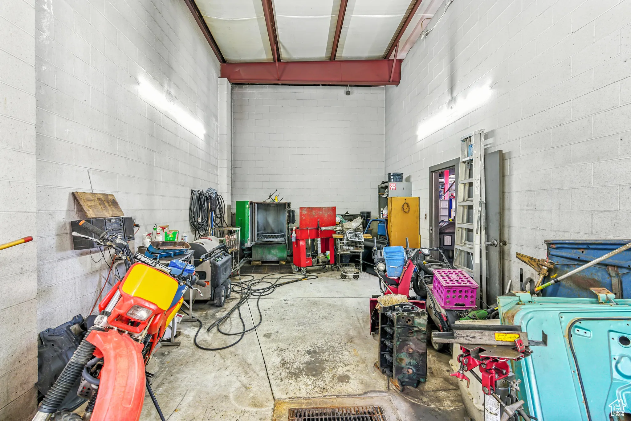 Garage featuring concrete block wall