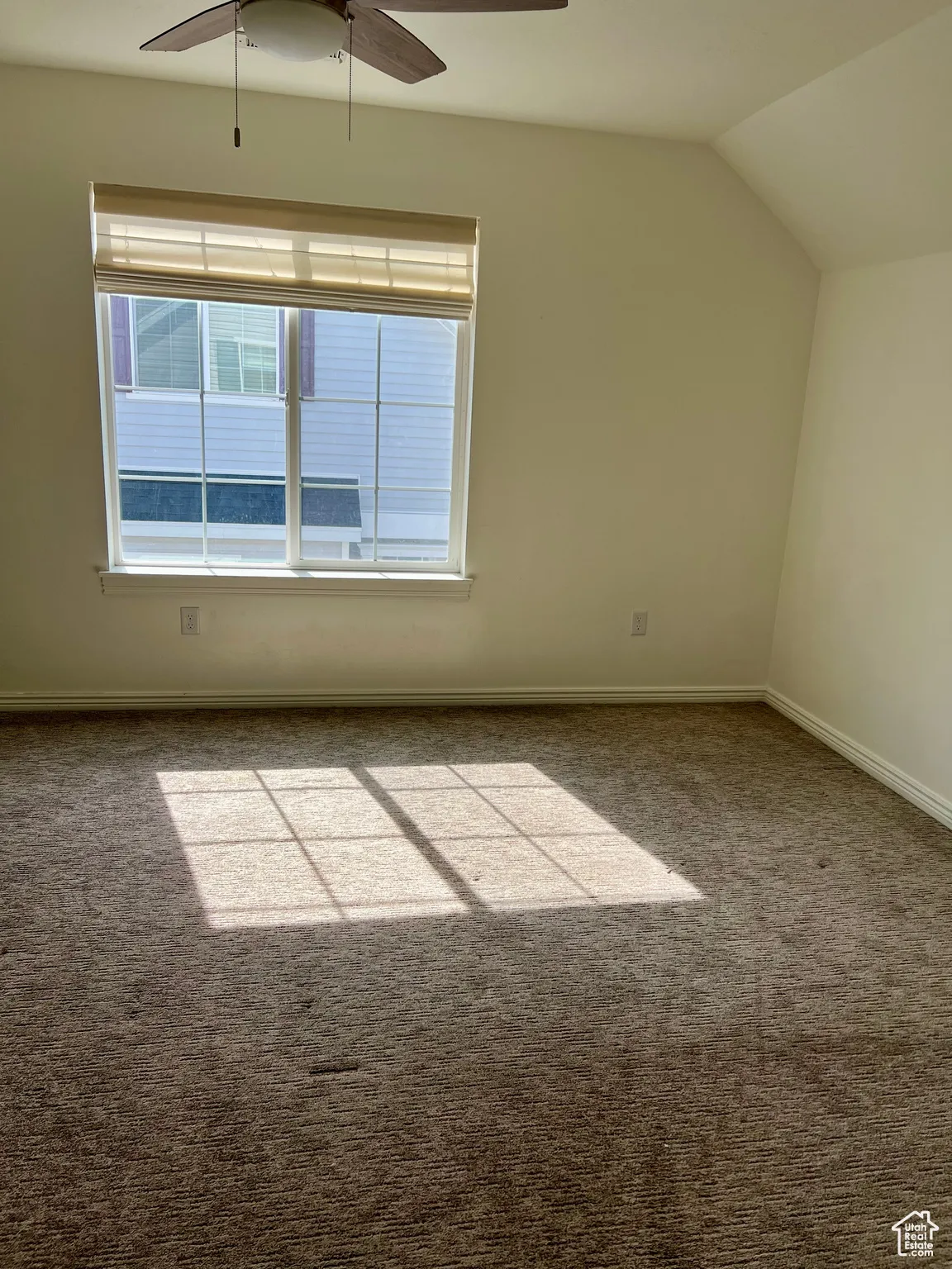 Upstairs bedroom,  ceiling fan, carpet flooring, and lofted ceiling