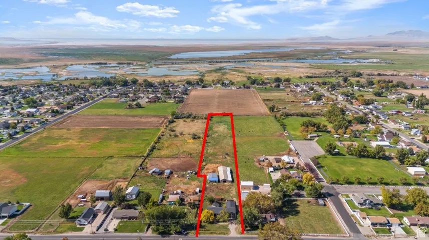 View of rural area featuring a large body of water and property parcel outlined