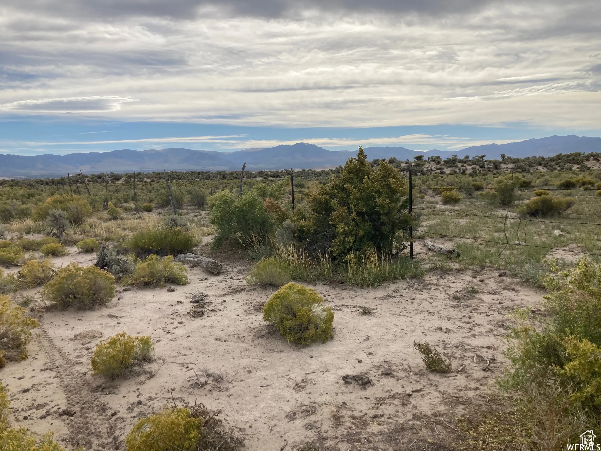 View of mountain backdrop featuring a desert landscape