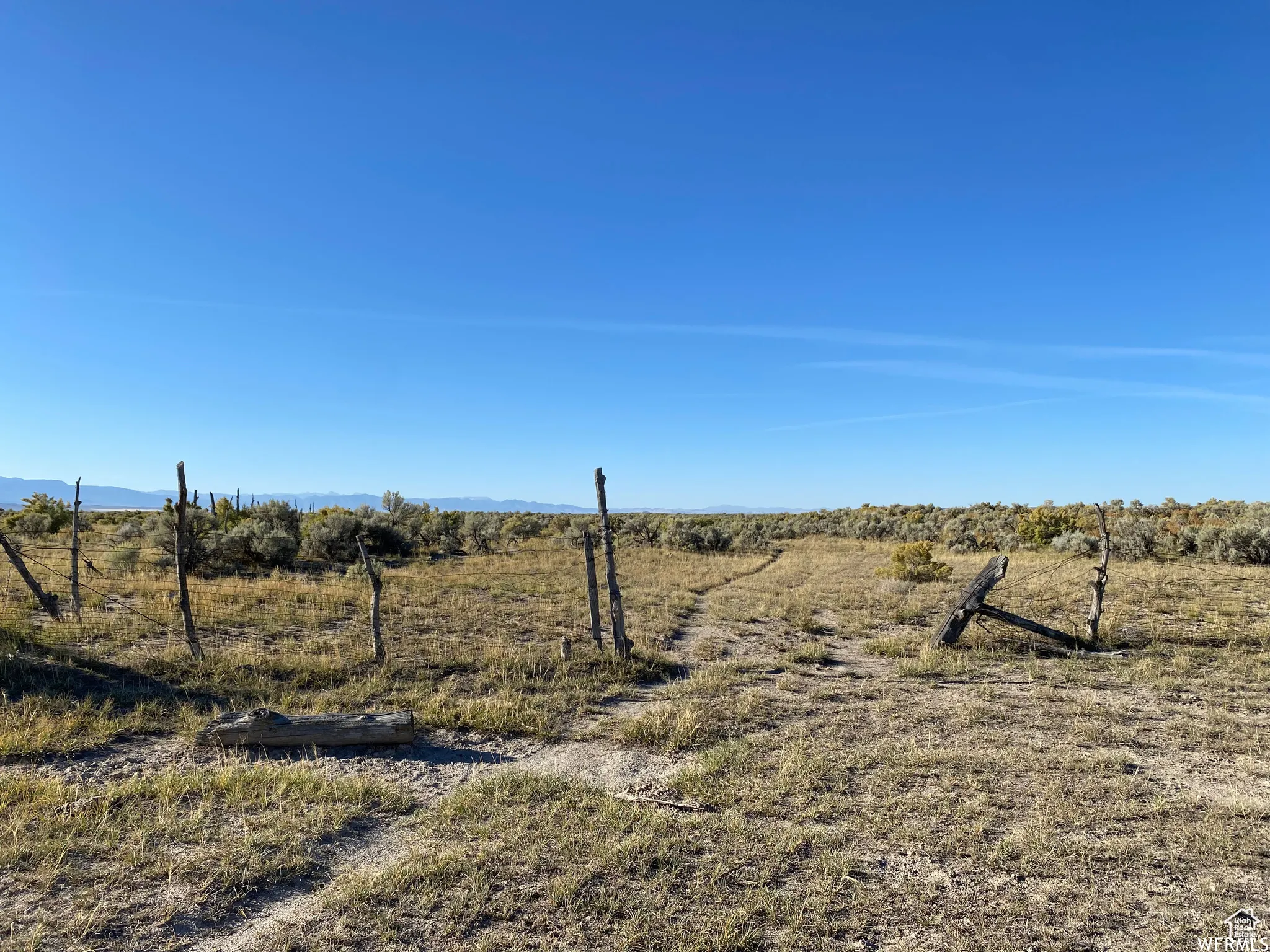 View of yard featuring a view of rural / pastoral area and a mountain view