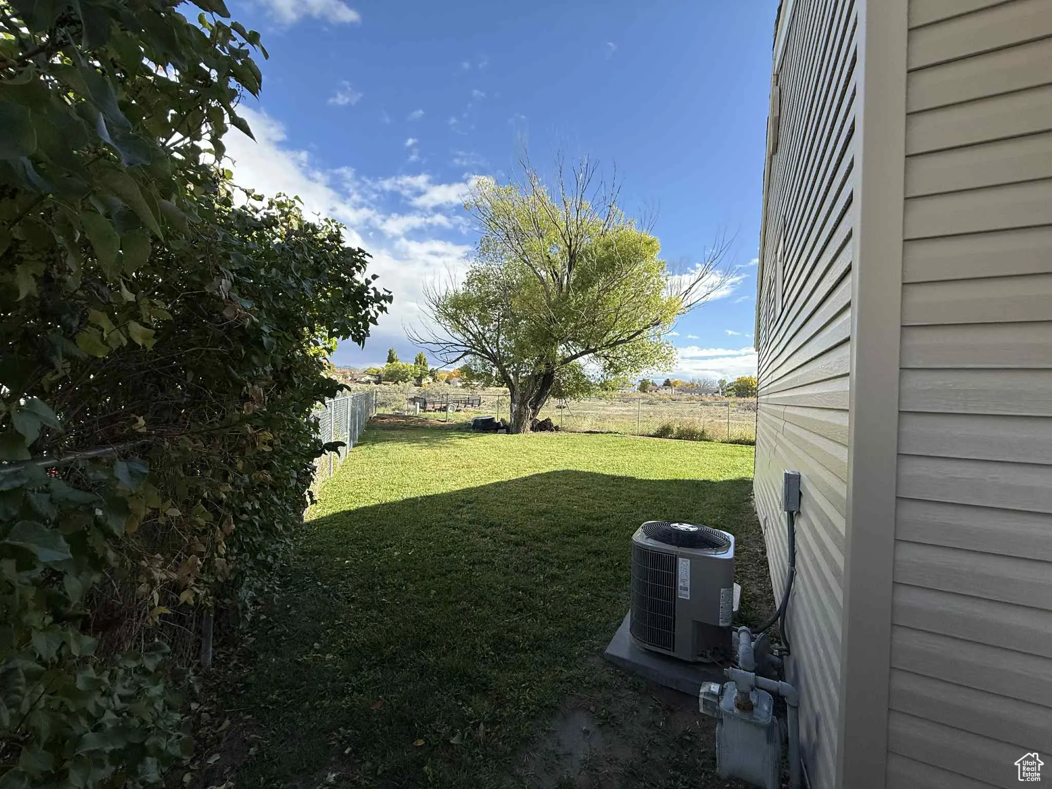 View of fenced backyard