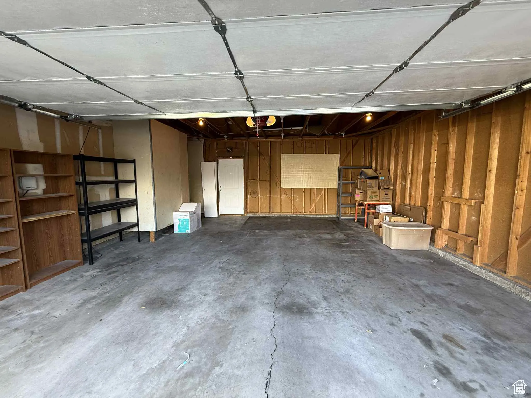 2 car garage featuring a garage door opener