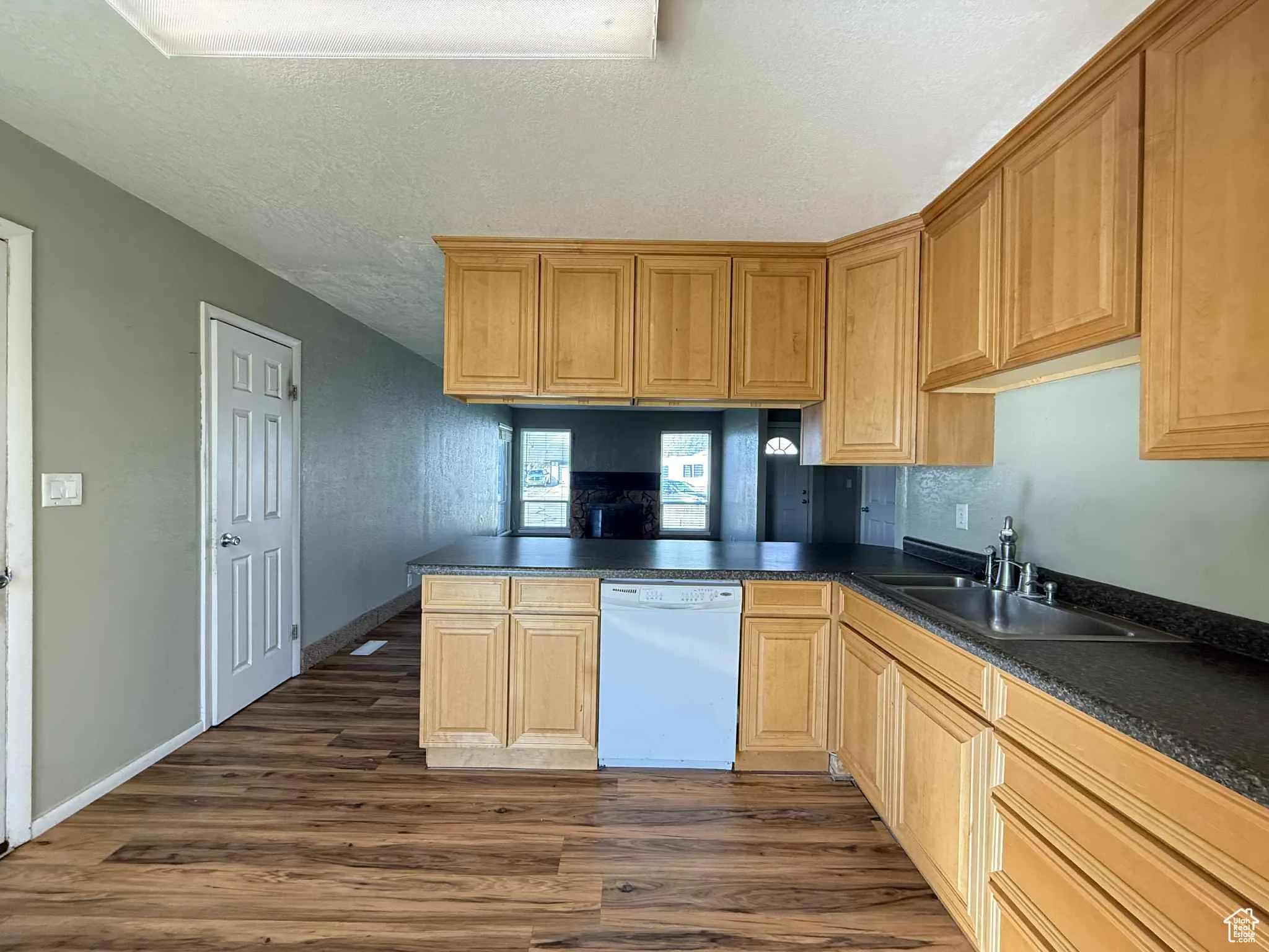View of kitchen from sliding door at back of house