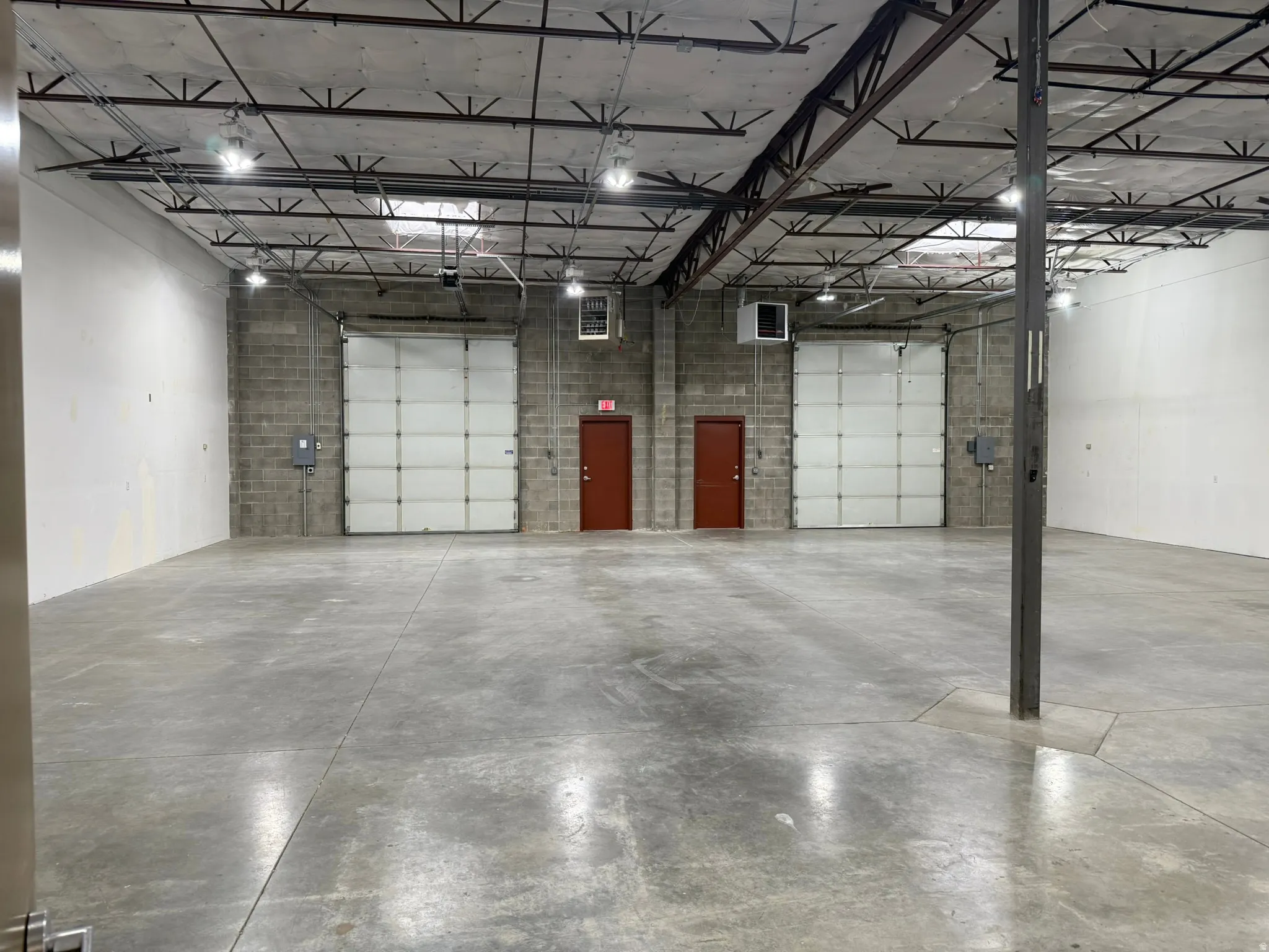 Garage featuring a heating unit