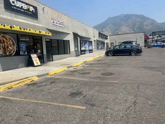 Commercial storefronts with mountain backdrop