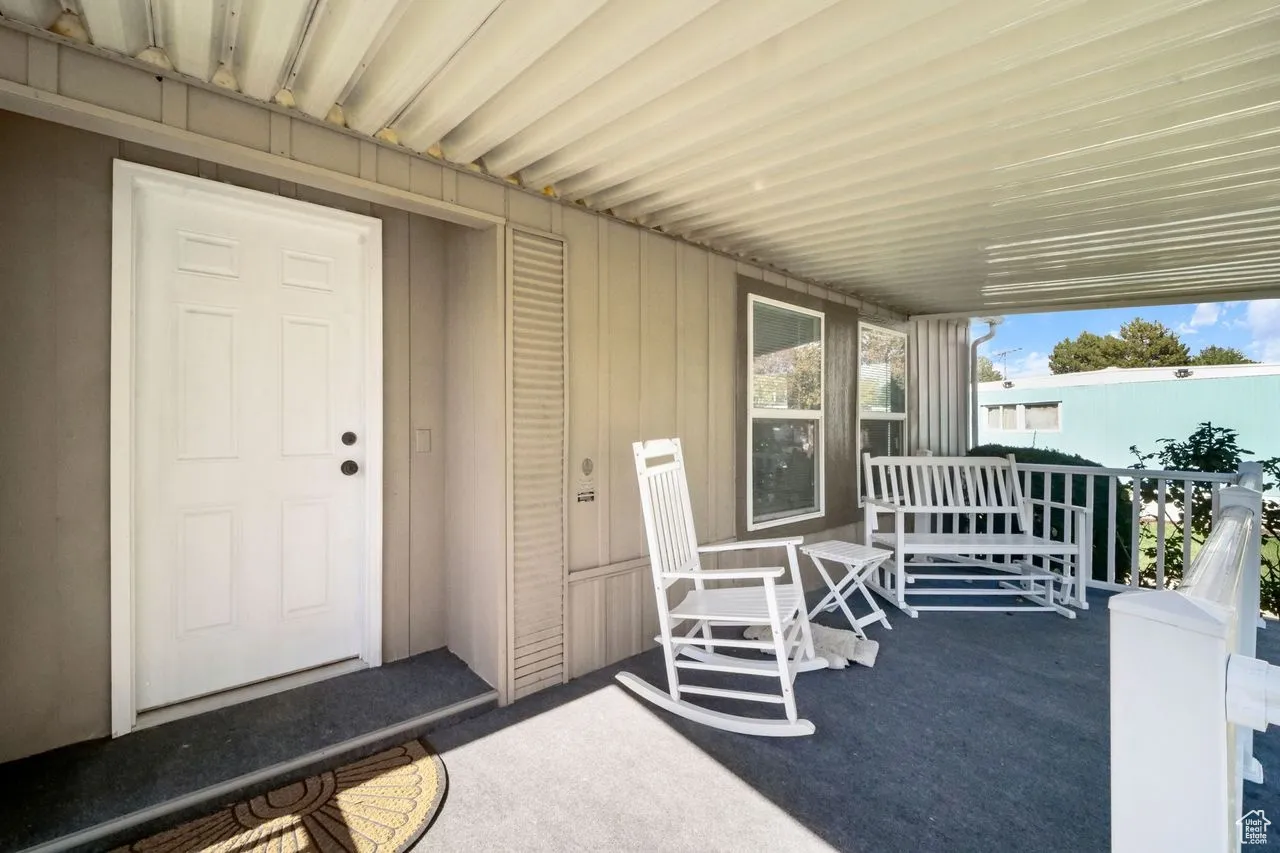 Property entrance featuring covered porch