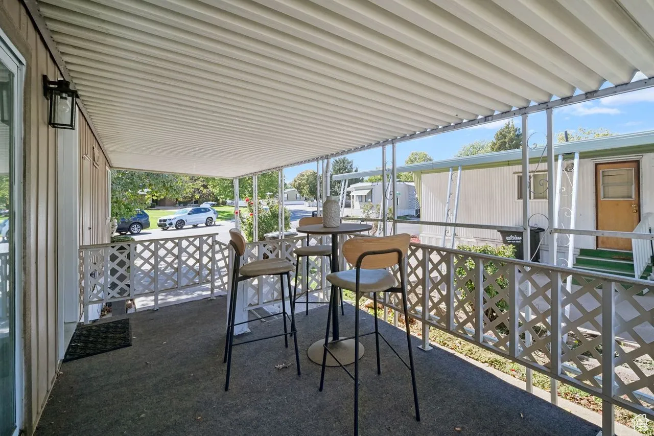 Sunroom featuring plenty of natural light and a residential view