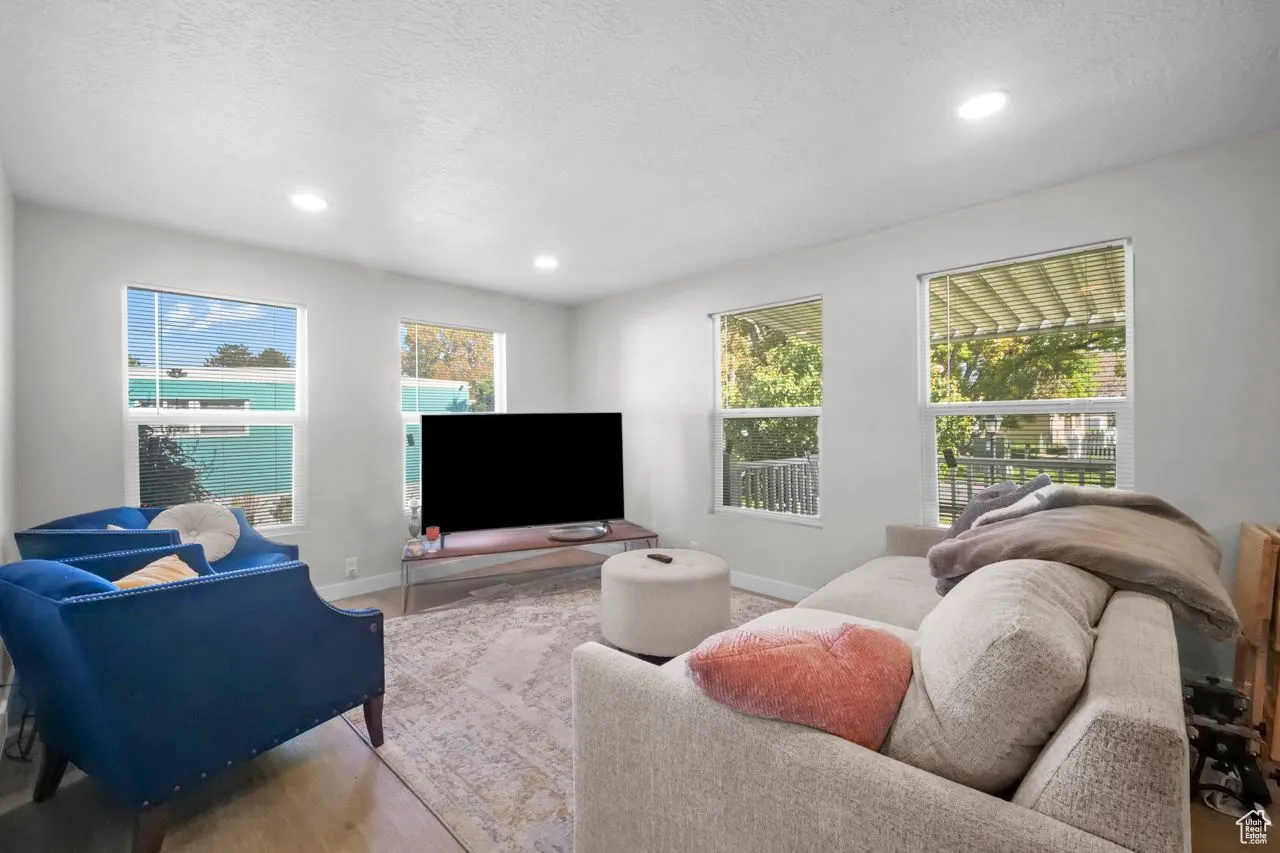 Living area with a textured ceiling and recessed lighting