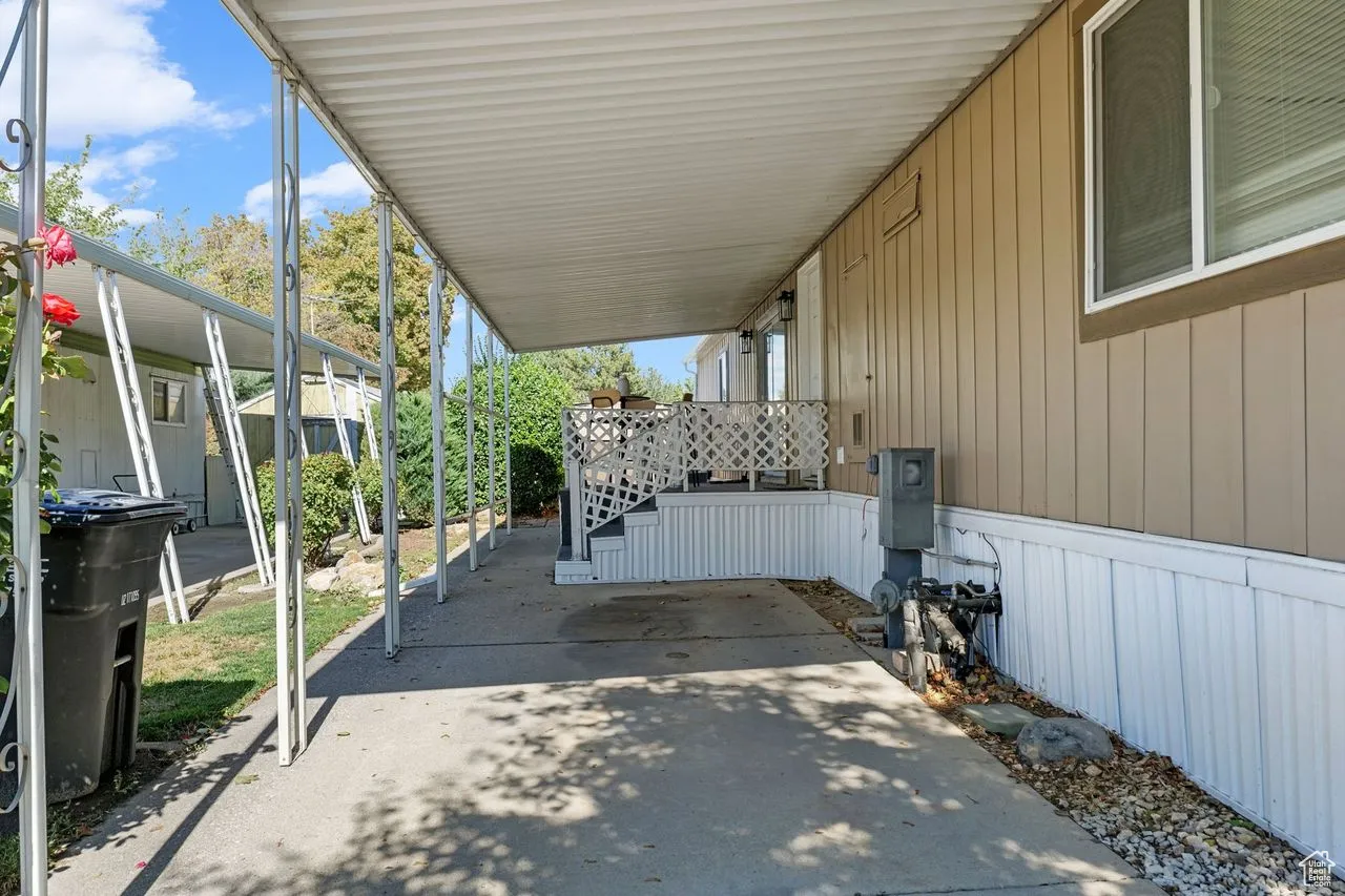 View of patio / terrace featuring an attached carport