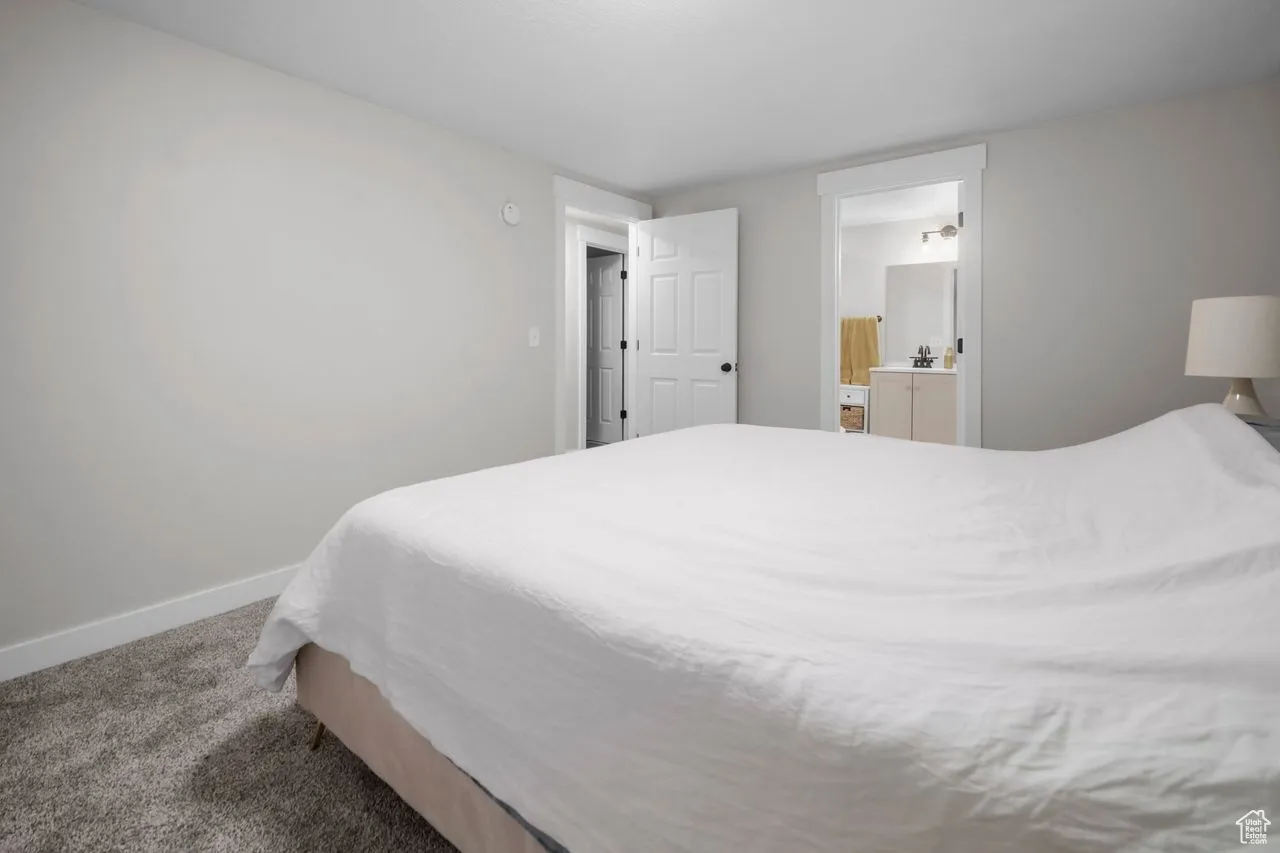 Bedroom with carpet and baseboards