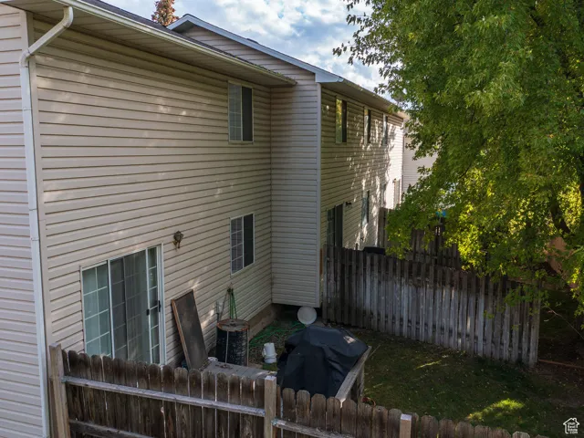Rear view of property featuring a patio area