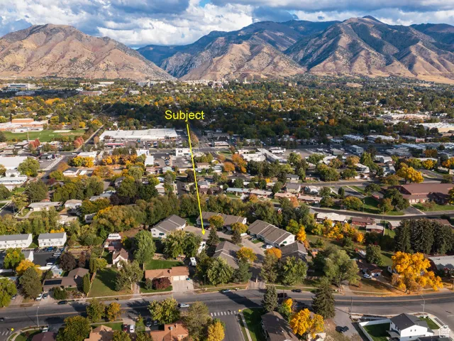 View of property location featuring a mountainous background and nearby suburban area