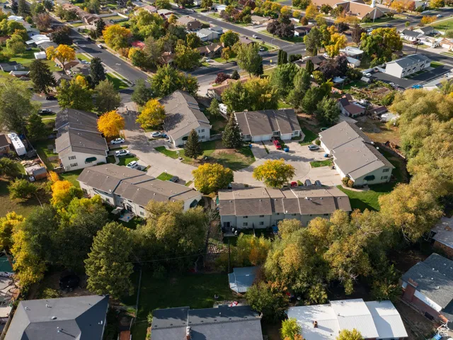 Aerial view of property's location with nearby suburban area