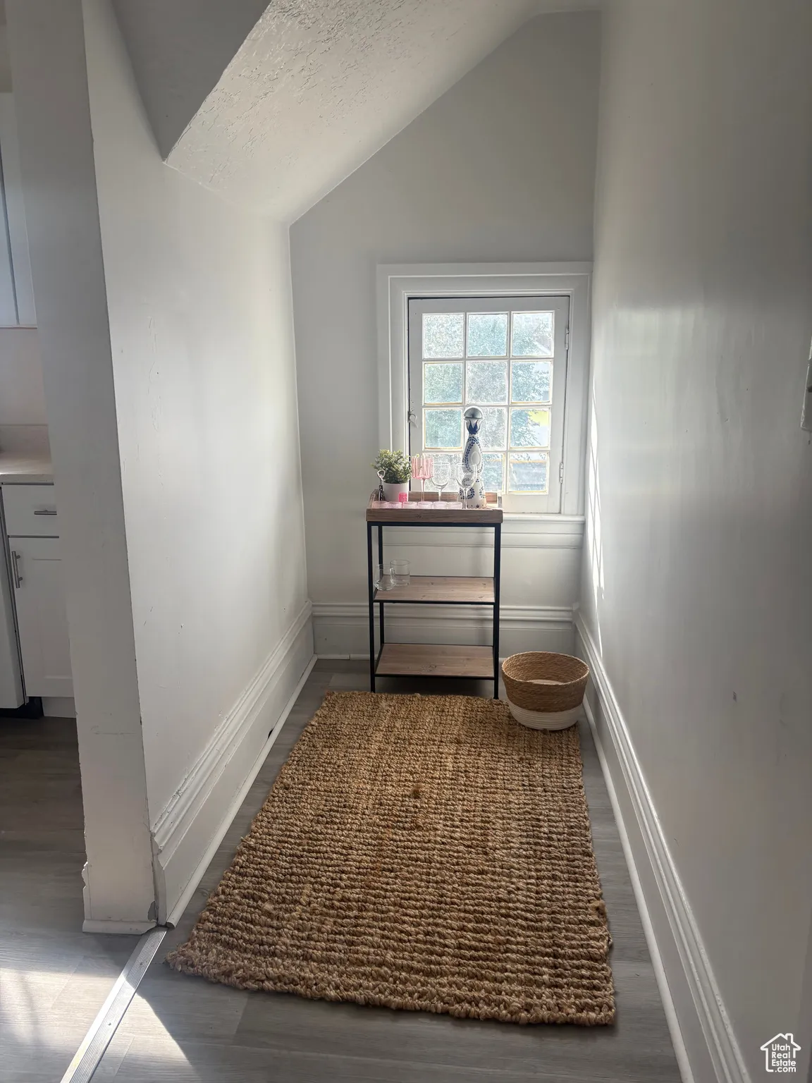 Detailed view of a textured ceiling and wood finished floors