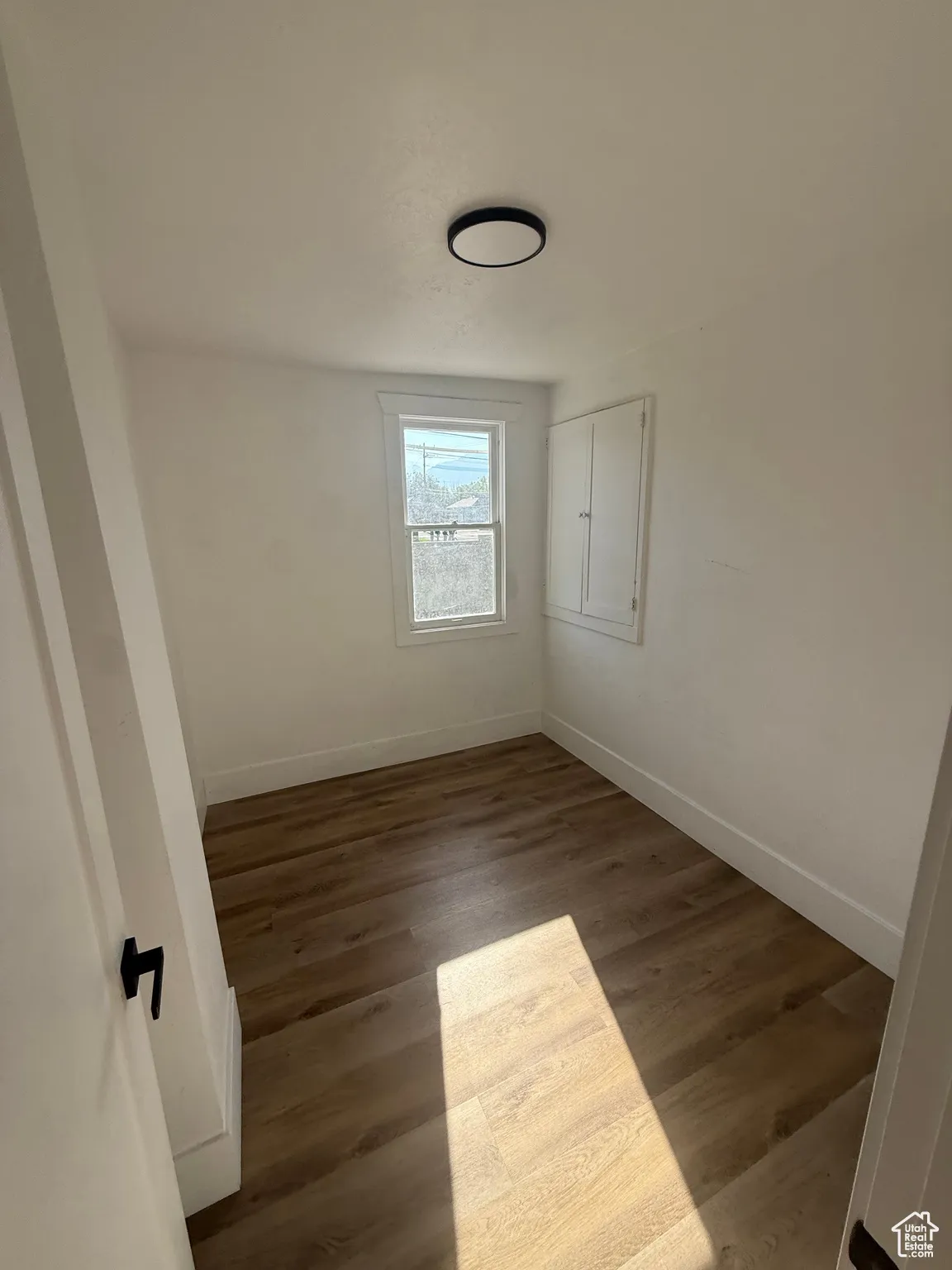 Room featuring wood finished floors