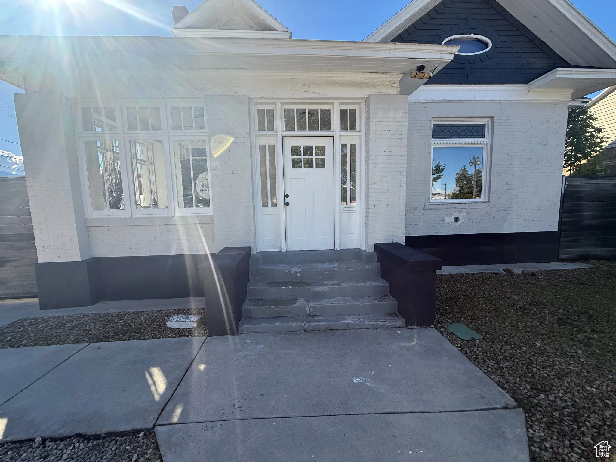 Doorway to property featuring brick siding