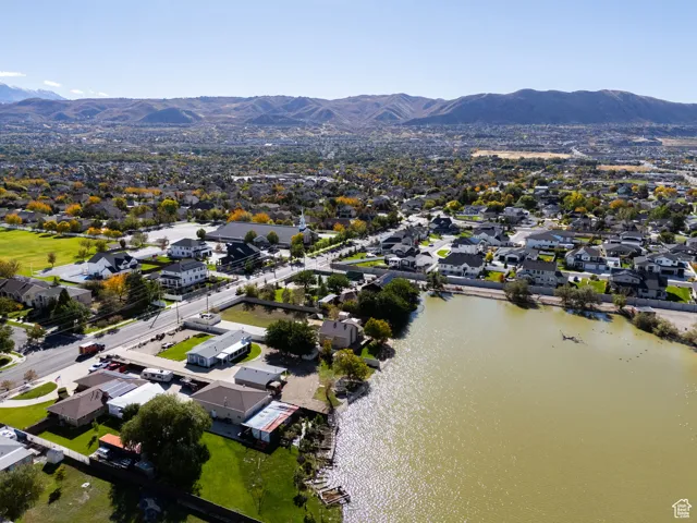 Aerial perspective of suburban area with a water and mountain view