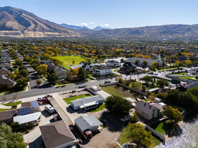 Aerial perspective of suburban area with a mountain backdrop