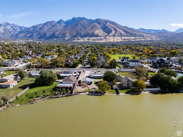 Aerial perspective of suburban area with a mountain backdrop
