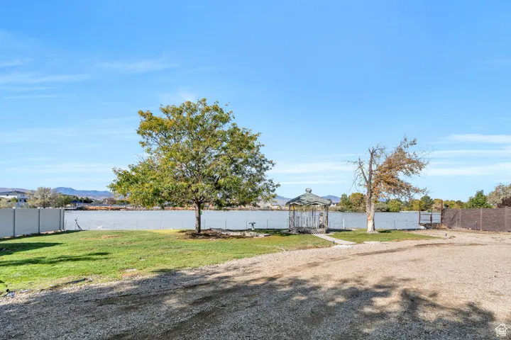 View of yard with a water view
