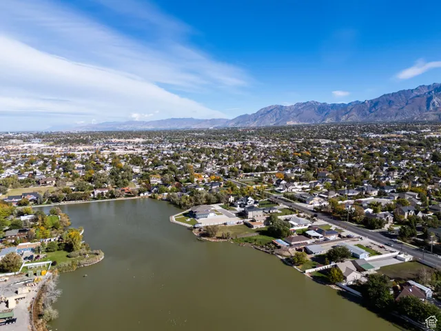 Aerial perspective of suburban area featuring a water and mountain view