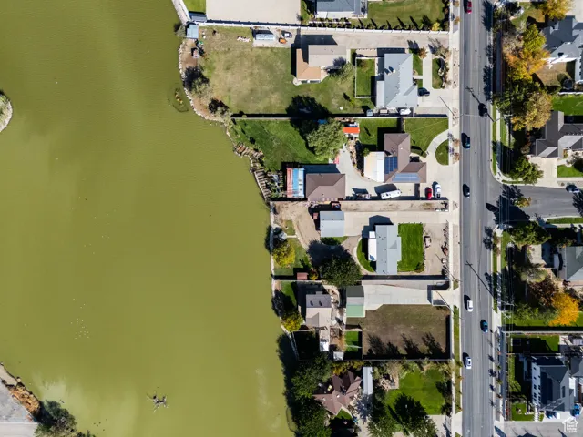 Aerial perspective of suburban area with a nearby body of water