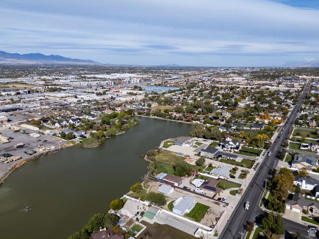 View of property location with nearby suburban area and a water and mountain view