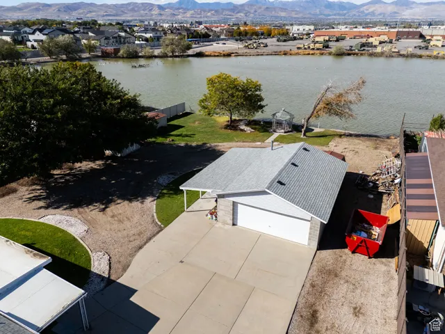 Aerial perspective of suburban area featuring a water and mountain view