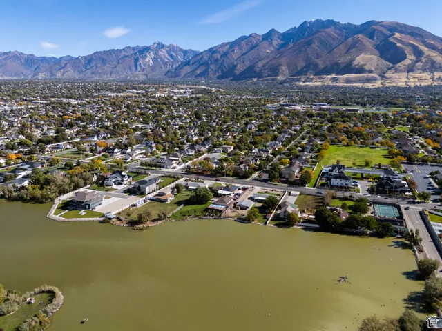 View of property location with nearby suburban area and a water and mountain view