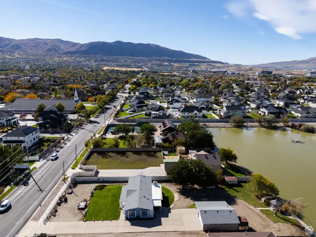 Aerial view of residential area featuring a water and mountain view