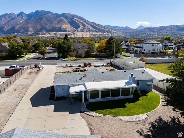 Aerial perspective of suburban area featuring a mountainous background