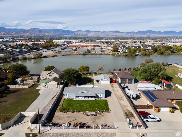 Aerial perspective of suburban area featuring a water and mountain view