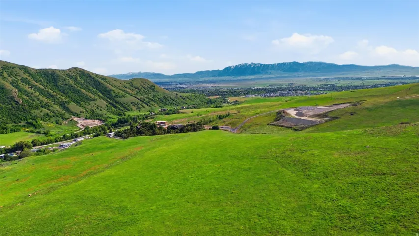 Expansive green hillsides featuring varied terrain