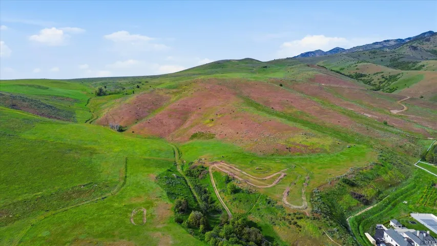 Expansive green hillsides featuring varied terrain