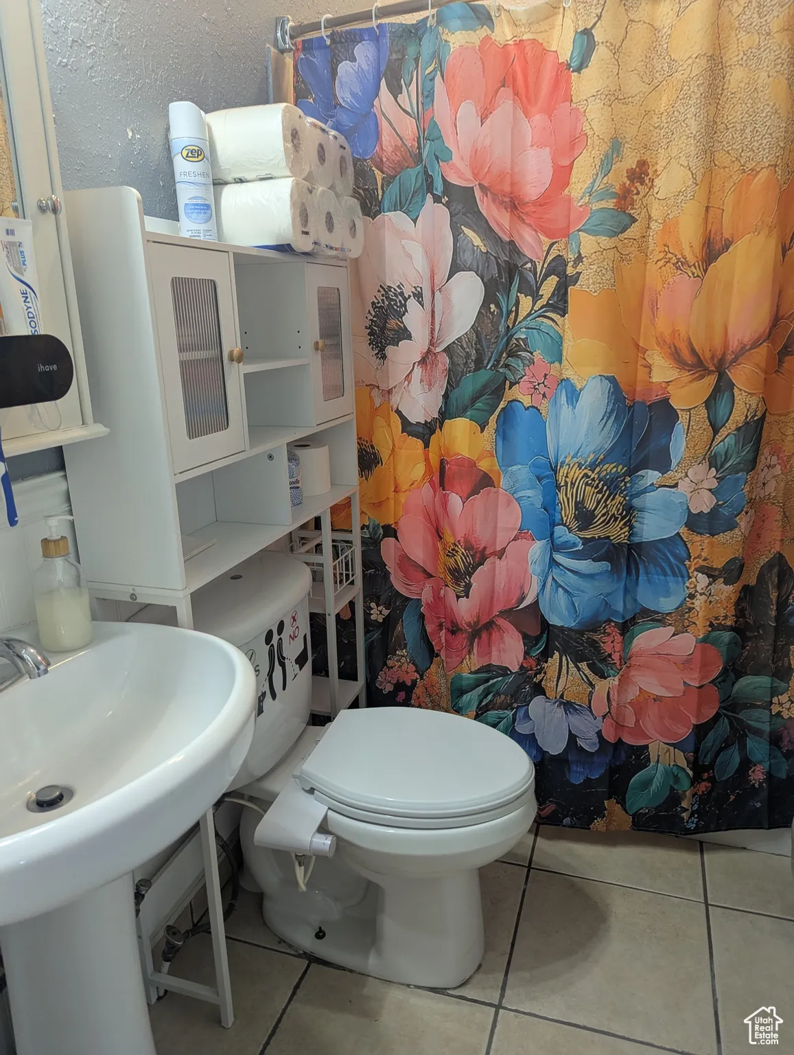 Bathroom featuring tile patterned flooring and a shower with curtain
