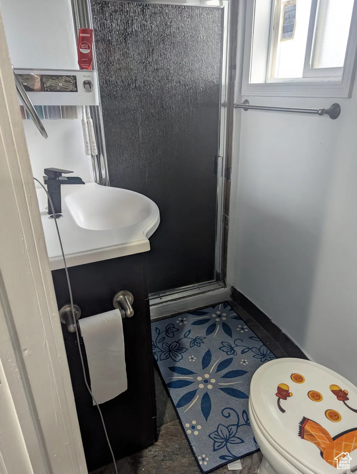 Bathroom with a stall shower and toilet