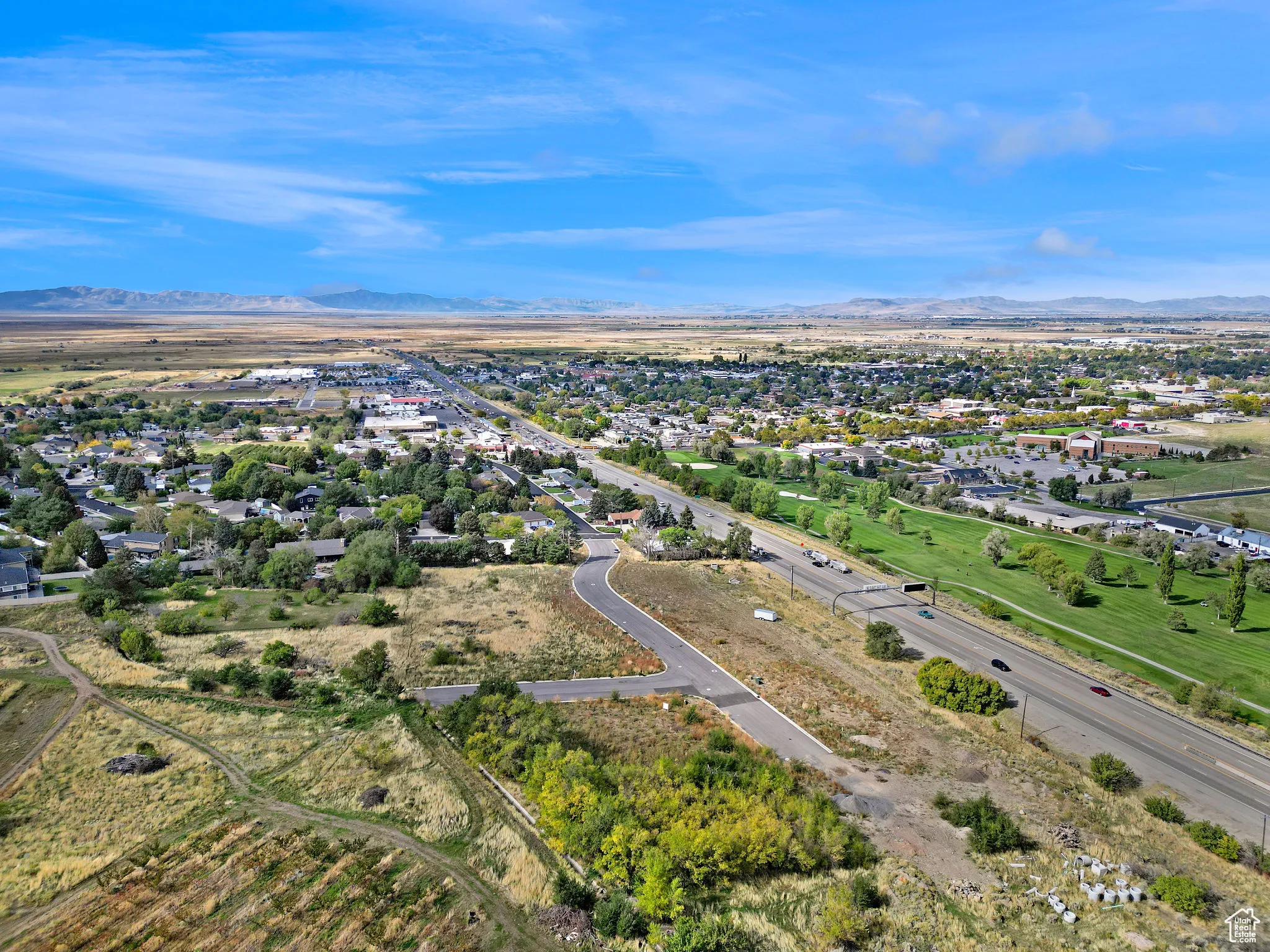Aerial view of residential area featuring a mountain backdrop